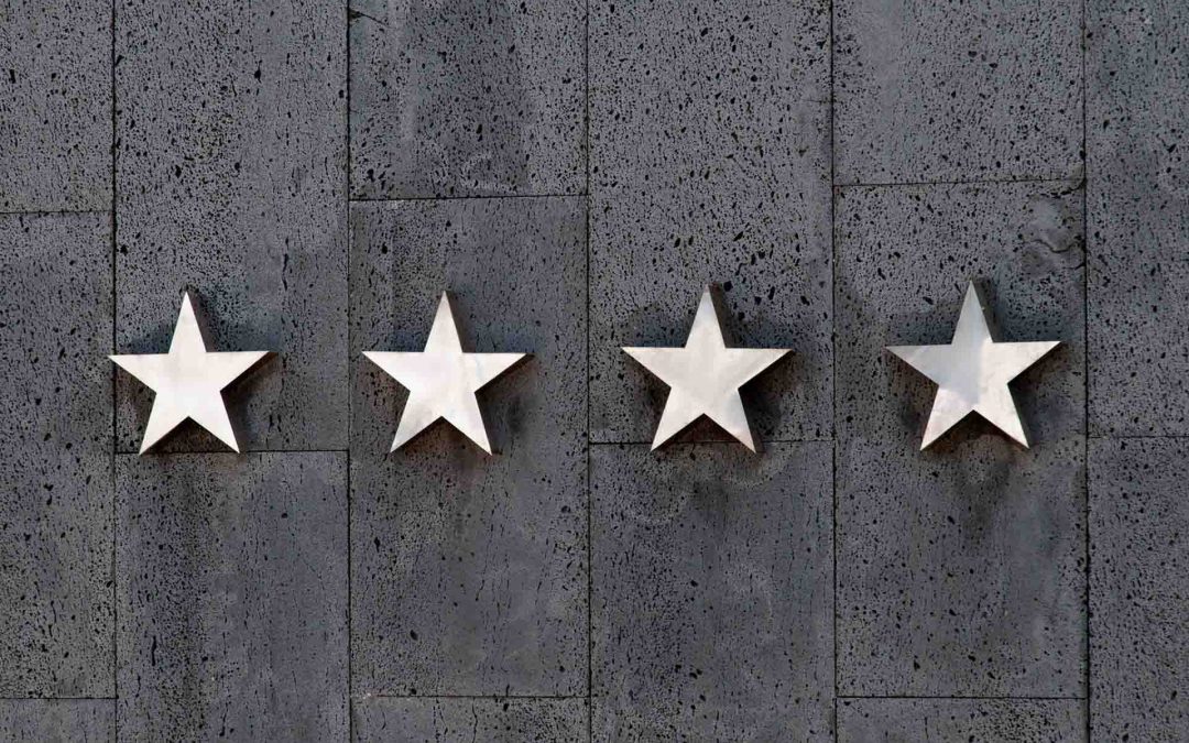 four stars on grey wall