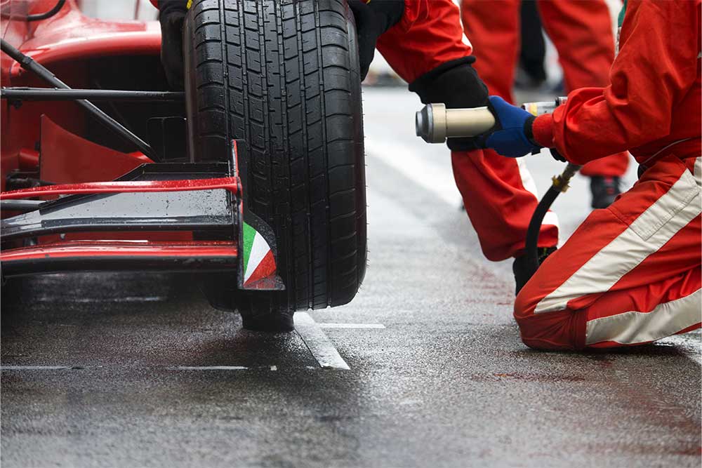 Image of a pit crew working on a race car