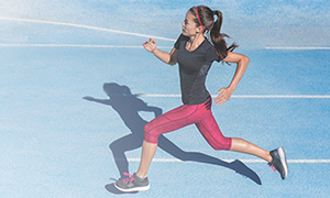 Woman running on a track